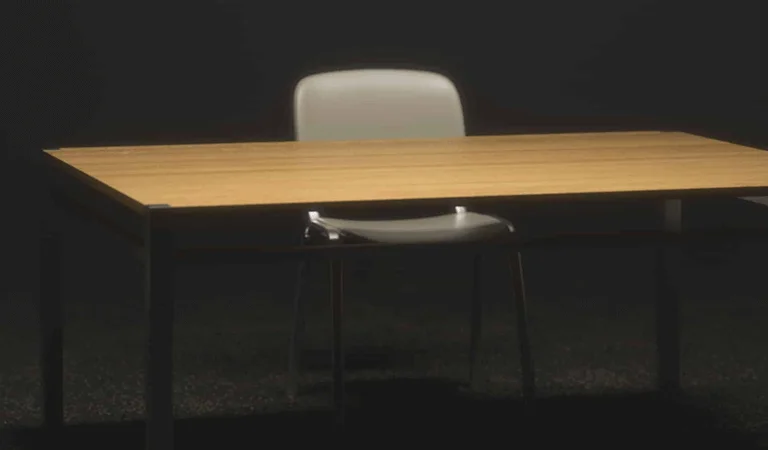 3D model of a table and chairs set in a dimly lit room, showcasing modern design elements and shadows.