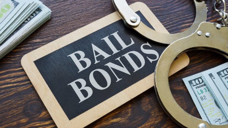 Plate Bail bonds and handcuffs on it