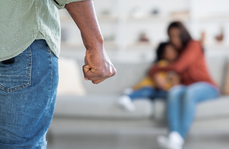 Man Threatening Wife And Daughter With His Fist