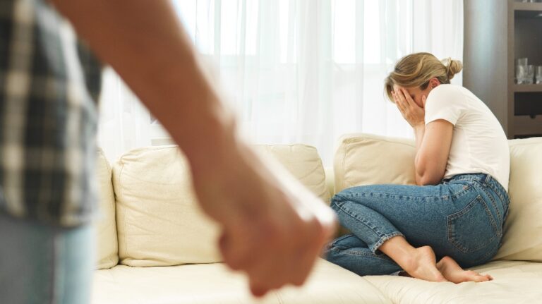 Scared woman victim of domestic violence