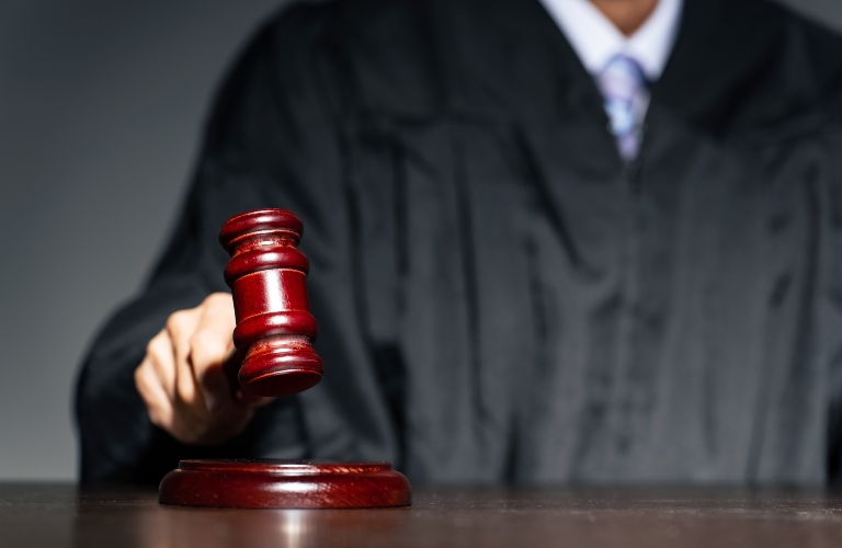 A judge hitting a mallet